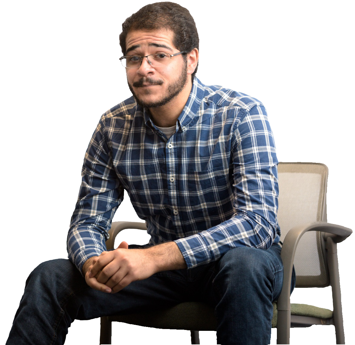 Michael sitting on a chair with a transparent background.